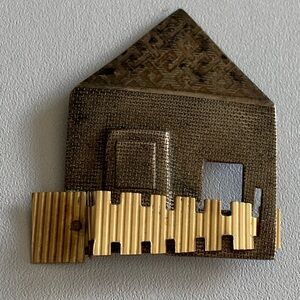 I believe that this is an unsigned Kathleen Doyle Tom Reardon sterling house pin